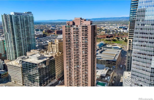 property's view of city with a mountain view