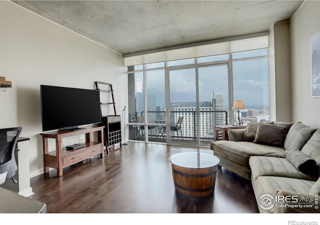 living room with expansive windows and wood finished floors