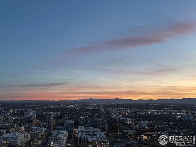 property's view of city featuring a mountain view