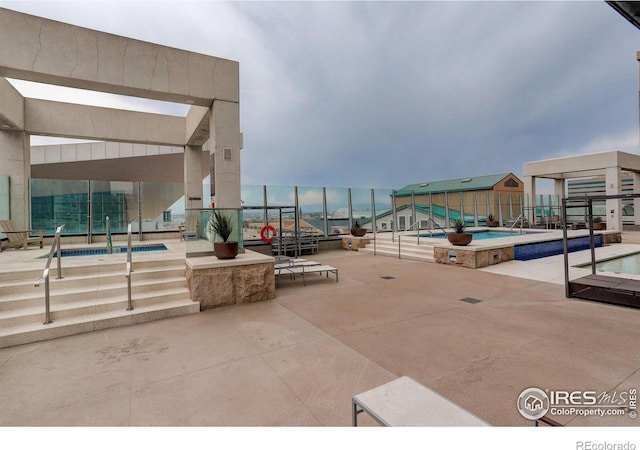 view of patio / terrace with a community pool