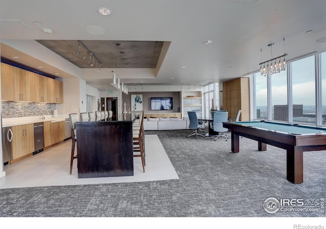 rec room featuring light colored carpet, rail lighting, and pool table