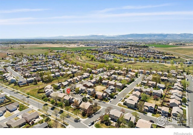 bird's eye view with a residential view and a mountain view