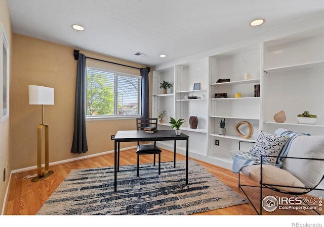 office with recessed lighting, baseboards, light wood finished floors, and visible vents