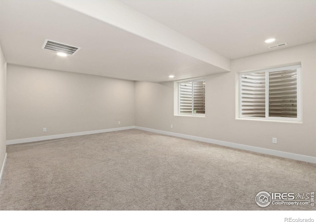 interior space featuring recessed lighting, baseboards, and visible vents