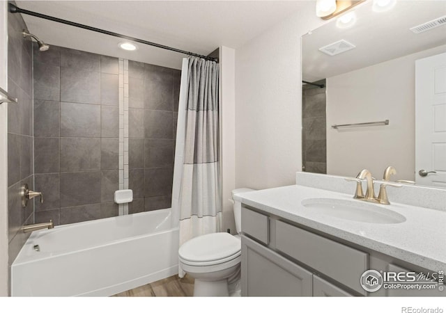 full bath with toilet, visible vents, shower / bathtub combination with curtain, and wood finished floors