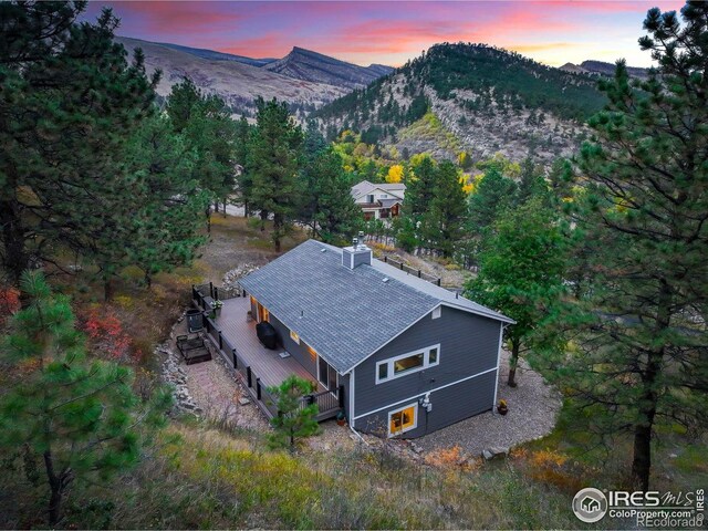 birds eye view of property with a mountain view