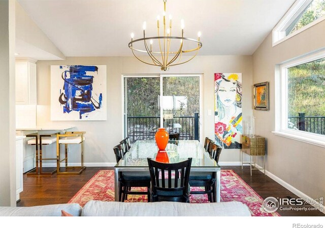 dining space with an inviting chandelier, baseboards, wood finished floors, and a wealth of natural light