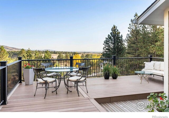 deck featuring outdoor dining area