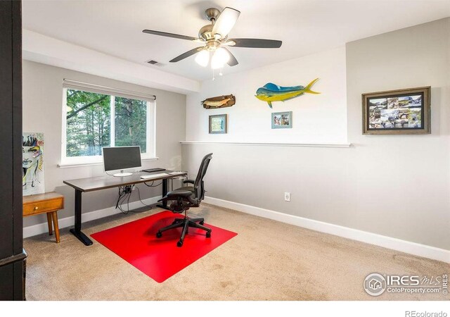 office area with baseboards, ceiling fan, carpet, and visible vents