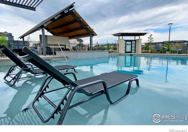 community pool featuring fence