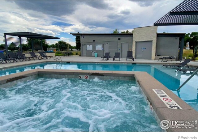 view of pool featuring fence