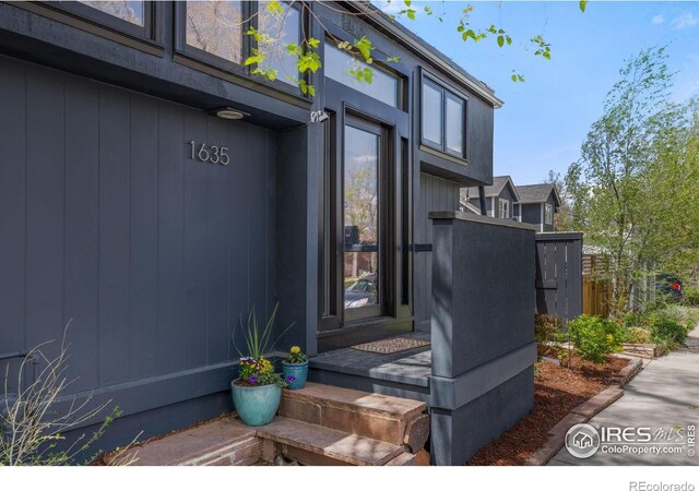 property entrance featuring fence