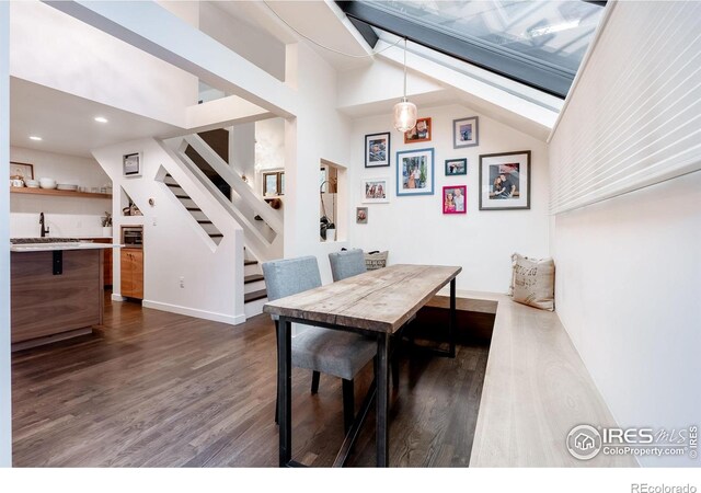 dining space featuring vaulted ceiling, stairway, baseboards, recessed lighting, and dark wood-type flooring