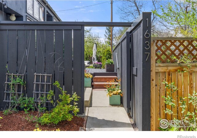 view of gate with fence