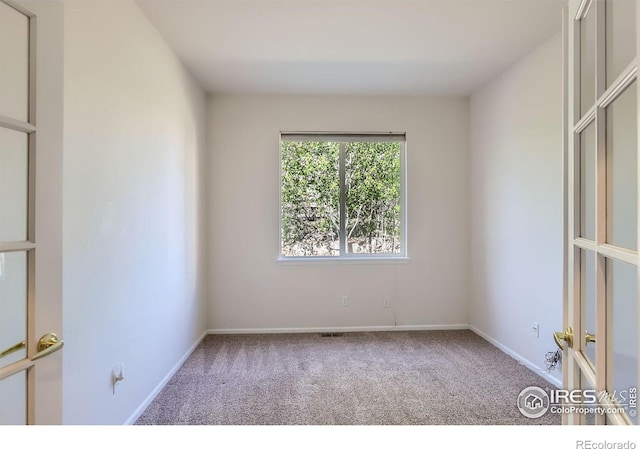 910 Pope Dr, Erie, CO 80516 - carpeted spare room with baseboards