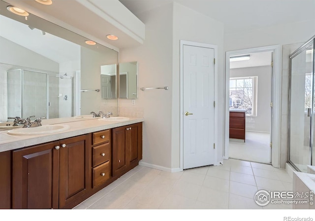 910 Pope Dr, Erie, CO 80516 - bathroom featuring double vanity, a shower stall, and a sink