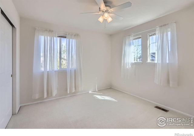 910 Pope Dr, Erie, CO 80516 - unfurnished bedroom featuring visible vents, a closet, baseboards, ceiling fan, and carpet