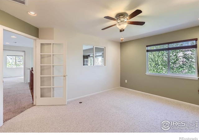 910 Pope Dr, Erie, CO 80516 - unfurnished room with carpet floors, baseboards, recessed lighting, french doors, and a ceiling fan