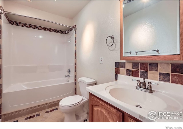 910 Pope Dr, Erie, CO 80516 - full bathroom featuring vanity, shower / bathing tub combination, a textured wall, and toilet