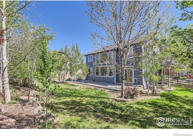910 Pope Dr, Erie, CO 80516 - view of yard featuring a patio area