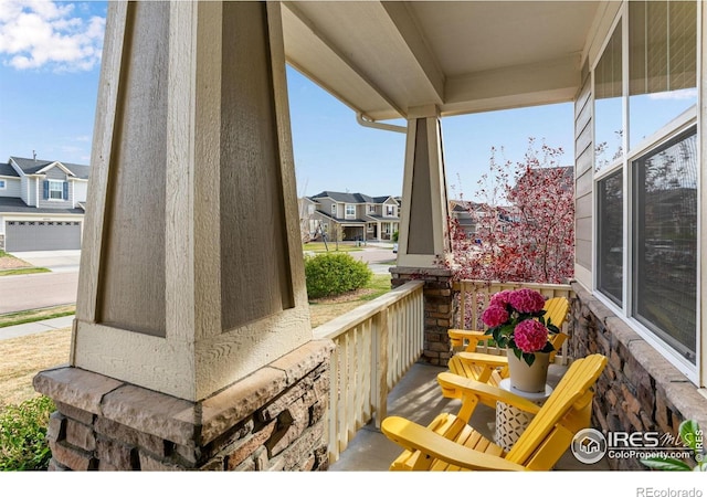 exterior space with a porch and a residential view