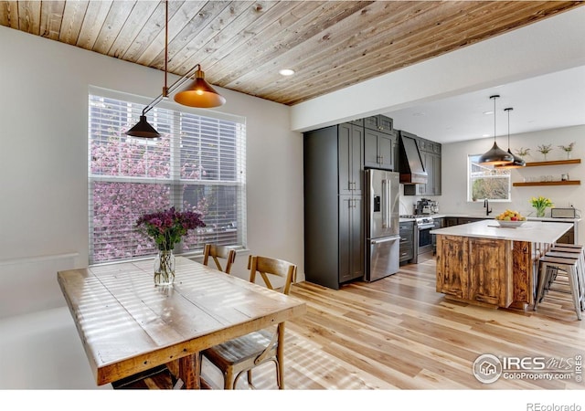 dining area with recessed lighting, wooden ceiling, and light wood-type flooring