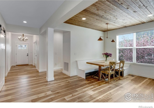 dining space featuring a notable chandelier, recessed lighting, light wood-style flooring, and visible vents