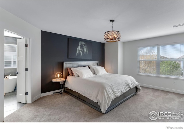 bedroom featuring baseboards, carpet flooring, and visible vents