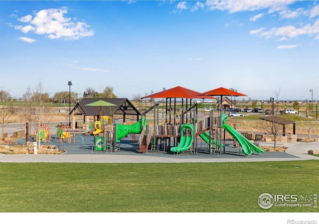 community play area featuring a lawn