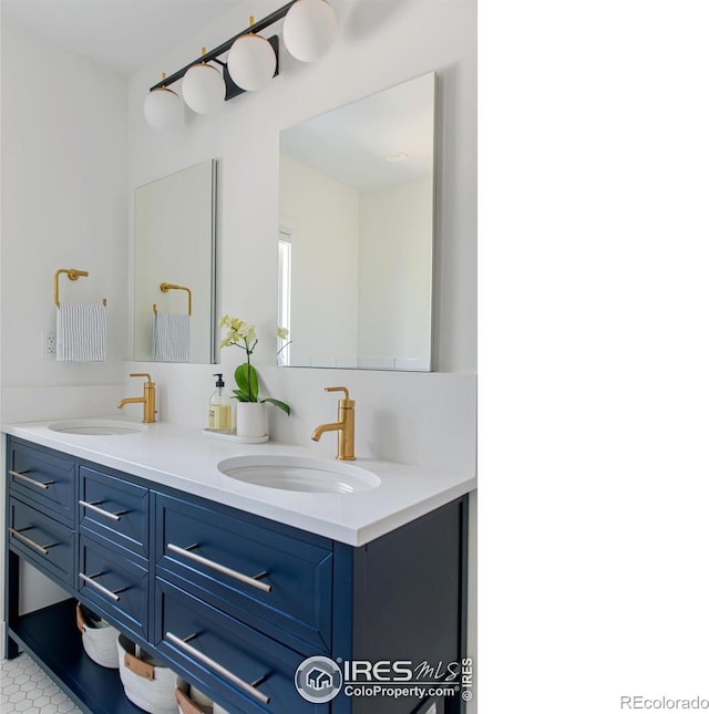full bath featuring a sink and double vanity