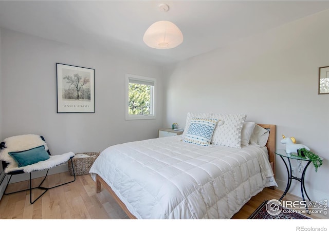 bedroom with wood finished floors