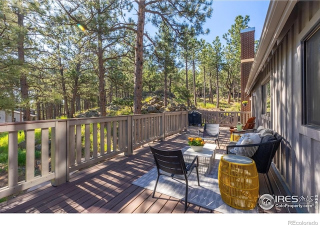 wooden deck featuring an outdoor living space