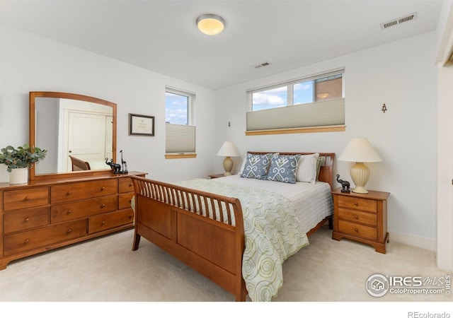 bedroom with visible vents and carpet floors