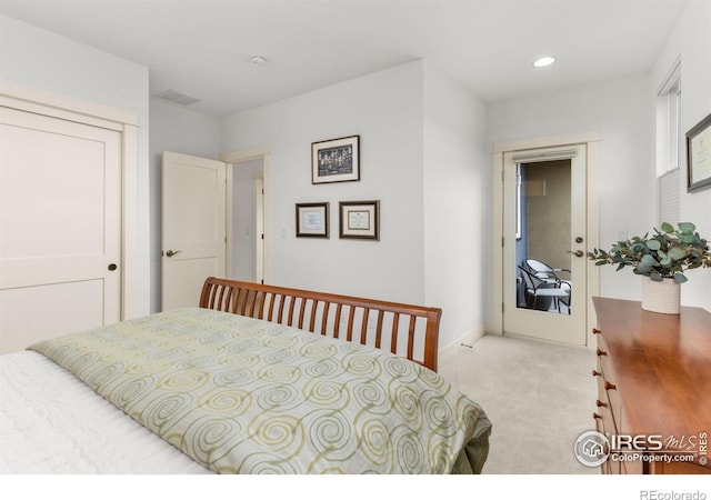 bedroom featuring baseboards, light colored carpet, recessed lighting, and visible vents