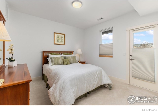 bedroom with baseboards, visible vents, access to exterior, and carpet