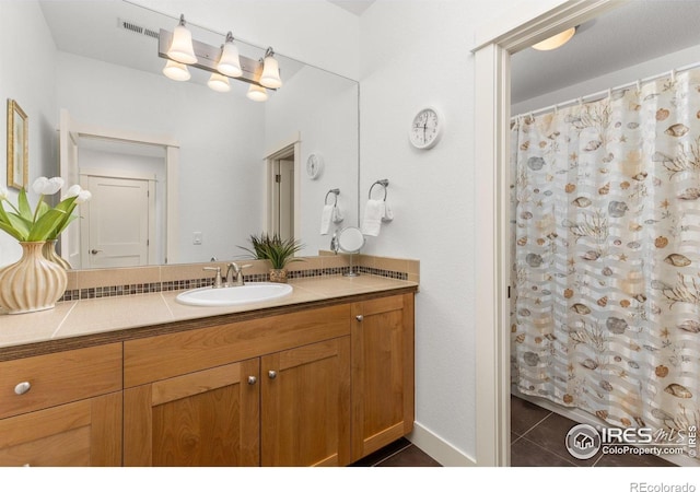 full bathroom featuring a shower with curtain, tile patterned floors, vanity, and visible vents
