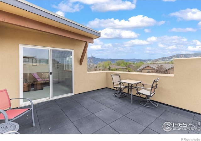 view of patio / terrace with a mountain view