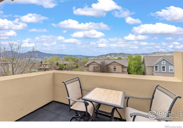 balcony with a mountain view and a residential view