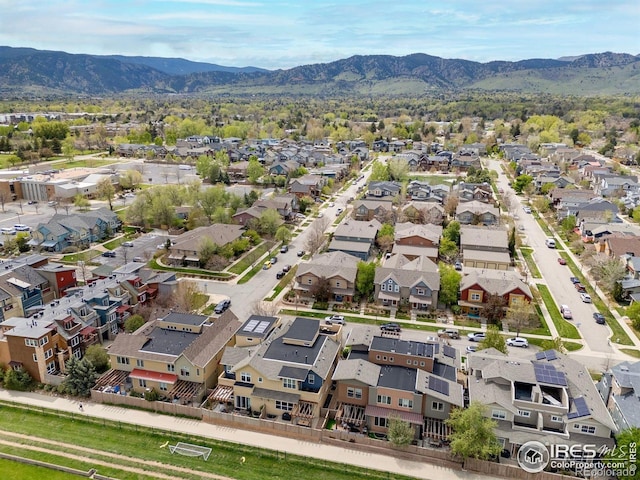 birds eye view of property featuring a mountain view and a residential view