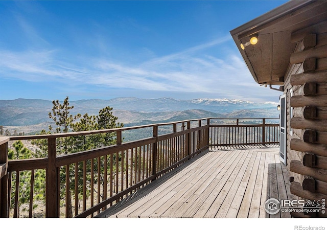 wooden terrace featuring a mountain view