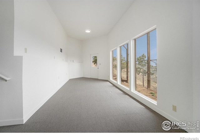 carpeted spare room with baseboards and recessed lighting