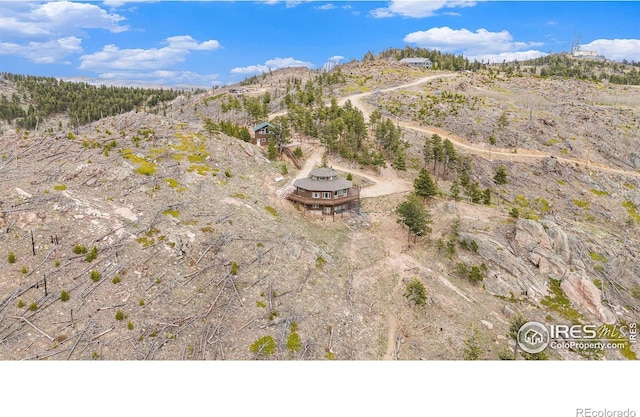 aerial view featuring a rural view and a mountain view