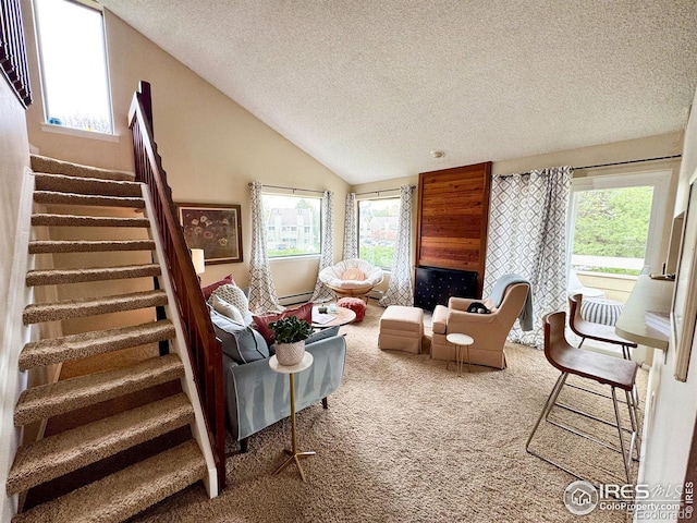 carpeted living room featuring a textured ceiling, lofted ceiling, a wealth of natural light, and stairway