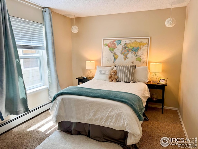 bedroom with carpet floors, a textured ceiling, baseboards, and a baseboard heating unit
