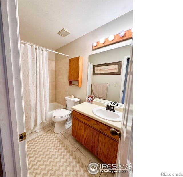full bath with visible vents, shower / bath combination with curtain, tile patterned flooring, vanity, and toilet