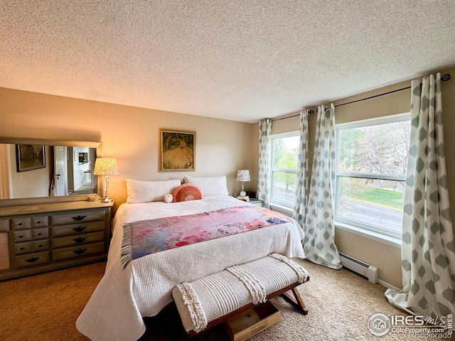 bedroom featuring a baseboard radiator, light carpet, and a textured ceiling