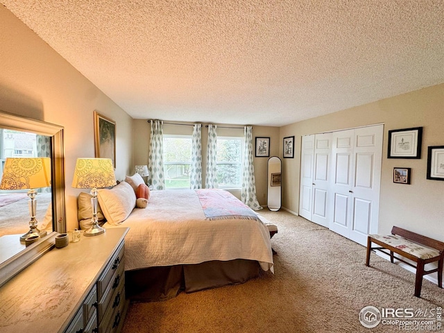 bedroom featuring a closet, carpet flooring, and a textured ceiling