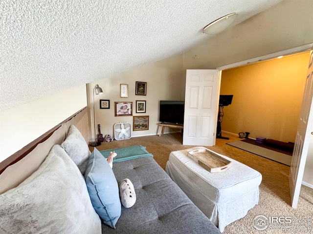 living room with carpet, vaulted ceiling, and a textured ceiling