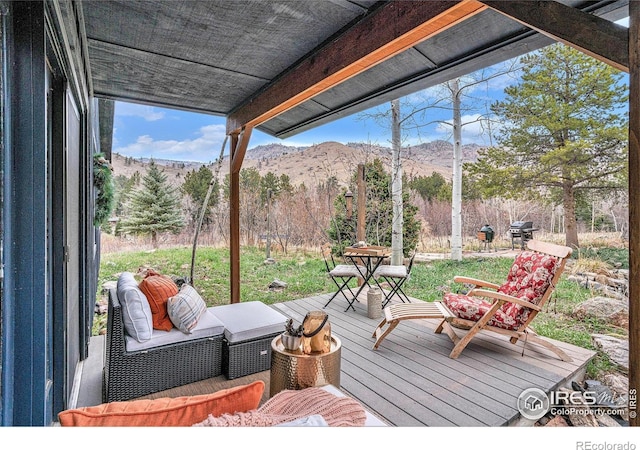 wooden terrace with a mountain view