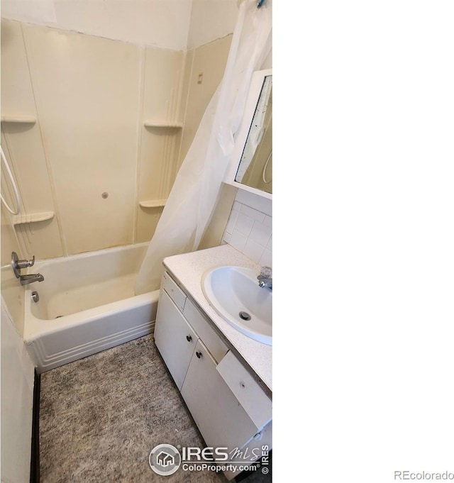 401 Park St, Sterling, CO 80751 - bathroom with vanity and shower / bathtub combination with curtain